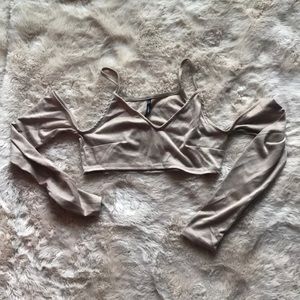 Shoulder-less long sleeve crop top.